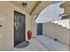 Close-up of a secure, gated front entrance featuring a decorative metal gate and a contemporary design at 814 Singing Drum Dr, Henderson, NV 89002