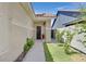 Inviting front entrance featuring a charming walkway, well-maintained landscaping, and a secure metal security gate at 814 Singing Drum Dr, Henderson, NV 89002