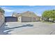 Ranch-style house showcasing a wide driveway leading to an attached garage, providing convenience and curb appeal at 814 Singing Drum Dr, Henderson, NV 89002
