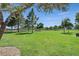 Expansive green space with lush lawn and scattered trees, perfect for recreation and relaxation at 814 Singing Drum Dr, Henderson, NV 89002
