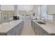 Well-equipped kitchen featuring white countertops, stainless steel appliances, gray cabinets, and an open layout at 814 Singing Drum Dr, Henderson, NV 89002