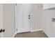 Laundry room with tile floors and white door at 814 Singing Drum Dr, Henderson, NV 89002
