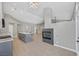 Bright living room boasts a modern fireplace and open floor plan for easy entertaining at 814 Singing Drum Dr, Henderson, NV 89002