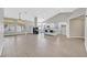 Bright, open-concept living space with modern fireplace, tile flooring, and an eat-in kitchen island at 814 Singing Drum Dr, Henderson, NV 89002