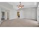 Spacious main bedroom with ceiling fan, carpeted floors, and an ensuite bathroom at 814 Singing Drum Dr, Henderson, NV 89002