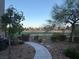 Backyard featuring a stone walking path leading to the beautiful green golf course at 908 Duckhorn Ct # 102, Las Vegas, NV 89144
