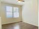 Bedroom with wood floors, ceiling fan, and plenty of natural light at 908 Duckhorn Ct # 102, Las Vegas, NV 89144