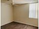 Comfortable bedroom featuring hardwood flooring and a ceiling fan with a window view at 908 Duckhorn Ct # 102, Las Vegas, NV 89144