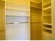 Spacious closet with plenty of shelving and rods for hanging clothes and accessories at 908 Duckhorn Ct # 102, Las Vegas, NV 89144