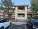 Exterior view of an apartment building showcasing a front facade and parking at 908 Duckhorn Ct # 102, Las Vegas, NV 89144