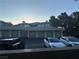 Apartment building garages viewed from an upper level, cars parked in front at 908 Duckhorn Ct # 102, Las Vegas, NV 89144