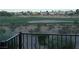 Scenic view of a pristine golf course surrounded by greenery, seen from an elevated patio at 908 Duckhorn Ct # 102, Las Vegas, NV 89144