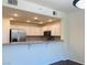 Open kitchen with stainless steel appliances and granite countertops at 908 Duckhorn Ct # 102, Las Vegas, NV 89144