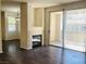 View of living room with fireplace and sliding glass doors to patio at 908 Duckhorn Ct # 102, Las Vegas, NV 89144