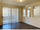 Spacious living room featuring wood floors and sliding glass doors at 908 Duckhorn Ct # 102, Las Vegas, NV 89144