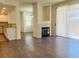 Inviting living room with modern fireplace, wood floors, and bright natural light at 908 Duckhorn Ct # 102, Las Vegas, NV 89144