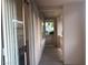 View of the patio with beige walls, concrete floor, and access from the living area at 908 Duckhorn Ct # 102, Las Vegas, NV 89144
