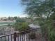 Scenic view from balcony overlooking lush green golf course and mature trees under a clear sky at 908 Duckhorn Ct # 102, Las Vegas, NV 89144