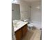 Bathroom with a shower, toilet, and vanity at 925 Falconhead Ln # 102, Las Vegas, NV 89128