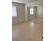 Bedroom with tile flooring, and closet with mirror doors at 925 Falconhead Ln # 102, Las Vegas, NV 89128
