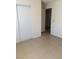 Bedroom with tile flooring and a closet at 925 Falconhead Ln # 102, Las Vegas, NV 89128