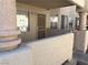 Exterior view of building entrance with unique columns and security door at 925 Falconhead Ln # 102, Las Vegas, NV 89128