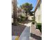 Exterior view of condo walkway with xeriscaping and desert landscaping at 925 Falconhead Ln # 102, Las Vegas, NV 89128
