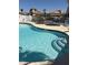 A community pool with steps, and a hot tub are visible in this inviting view at 925 Falconhead Ln # 102, Las Vegas, NV 89128