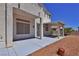 Backyard featuring a covered patio, rock landscaping, and view of the neighborhood at 975 Leadville Meadows Dr, Henderson, NV 89052