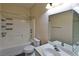 Bright bathroom featuring a tub with shower and modern fixtures at 975 Leadville Meadows Dr, Henderson, NV 89052