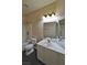 Functional bathroom featuring a vanity with ample counter space, a mirror, and a shower-tub combo for convenience at 975 Leadville Meadows Dr, Henderson, NV 89052