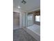 Bathroom featuring glass shower, soaking tub, and neutral tiling at 975 Leadville Meadows Dr, Henderson, NV 89052