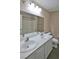 Bathroom featuring a double sink vanity with white cabinets and a large mirror at 975 Leadville Meadows Dr, Henderson, NV 89052