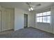 Bedroom featuring plush gray carpet, white trim and doors, and a closet at 975 Leadville Meadows Dr, Henderson, NV 89052