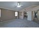 Large carpeted primary bedroom with archway and ensuite entrance at 975 Leadville Meadows Dr, Henderson, NV 89052