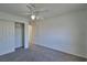 Bedroom featuring plush gray carpet, white trim, closet, and neutral walls at 975 Leadville Meadows Dr, Henderson, NV 89052