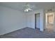 Bedroom featuring plush gray carpet, white trim, closet, and neutral walls at 975 Leadville Meadows Dr, Henderson, NV 89052