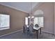 Inviting dining area with chandelier lighting and bright windows at 975 Leadville Meadows Dr, Henderson, NV 89052
