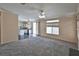 Open-concept living room leading into kitchen with abundant natural light at 975 Leadville Meadows Dr, Henderson, NV 89052