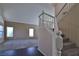Elegant staircase with white railing and carpeted steps connects the home's levels, complemented by stylish flooring at 975 Leadville Meadows Dr, Henderson, NV 89052