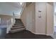 Inviting entry featuring a staircase with wood-look floors and neutral walls, leading to the upper level at 975 Leadville Meadows Dr, Henderson, NV 89052