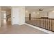 Bright living room with elegant railing and staircase, creating an inviting and airy atmosphere with seamless transitions at 9853 Russian Hill St, Las Vegas, NV 89141