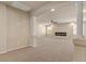 Spacious living room with a modern linear fireplace and decorative pillars at 9853 Russian Hill St, Las Vegas, NV 89141