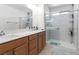 Bright bathroom with double vanity, walk-in shower and tile flooring at 10013 Sable Point St, Las Vegas, NV 89178