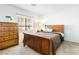 Bedroom featuring a wooden bed frame, dresser, and a bright window at 10013 Sable Point St, Las Vegas, NV 89178