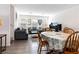 Open dining and living area featuring hardwood floors and abundant natural light at 10013 Sable Point St, Las Vegas, NV 89178