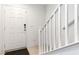 Bright entryway featuring a white staircase and neutral decor at 10013 Sable Point St, Las Vegas, NV 89178