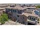 Aerial exterior showcasing a multi-story townhome with a balcony at 10013 Sable Point St, Las Vegas, NV 89178