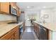 Bright kitchen featuring stainless appliances, granite countertops, and ample cabinet space at 10013 Sable Point St, Las Vegas, NV 89178