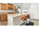 Modern kitchen featuring stainless steel appliances and breakfast bar with seating at 10013 Sable Point St, Las Vegas, NV 89178